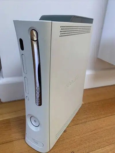Xbox 360 Falcon with 1 wireless controller 60 games.