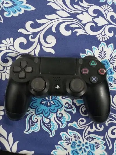PS4 with controllers and 5 games