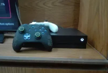 Xbox one x with 2 controllers and games