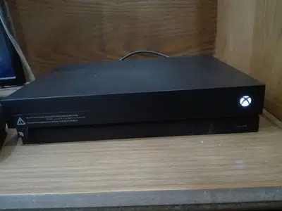 Xbox one x with 2 controllers and games